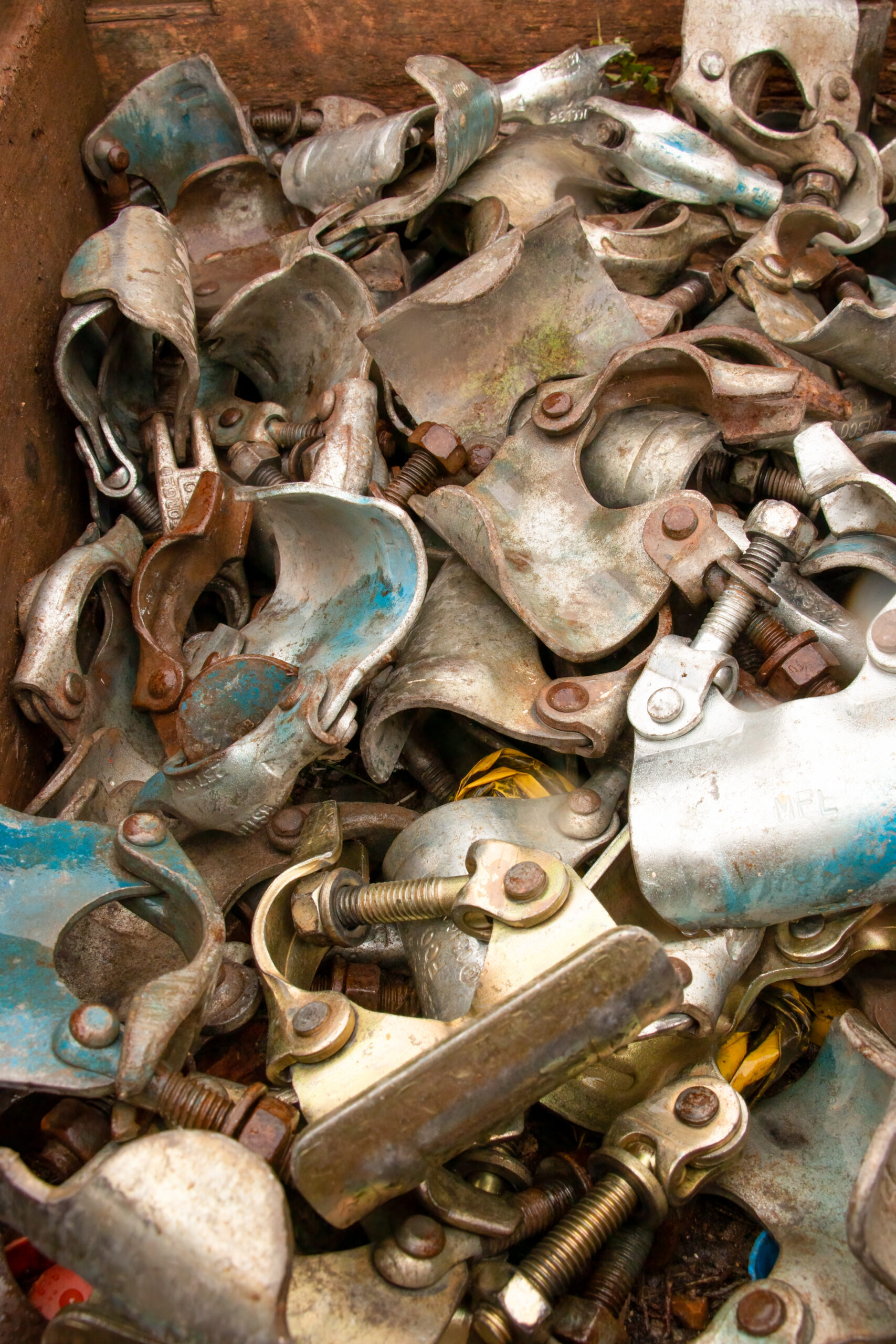 Background pile of scaffolding metal connectors